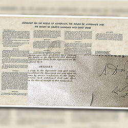 Repairing a tear in a space memorabilia NASA Apollo 15 mission document
